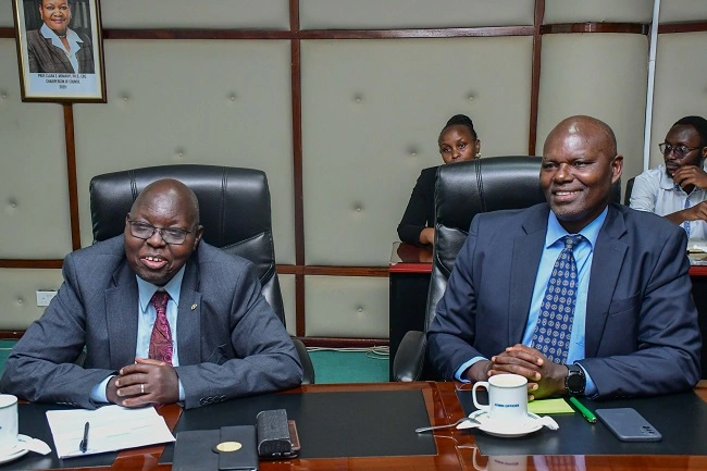 Prof. Maina Mwangi, Executive Dean school of Agriculture and Enviromental Sciences and Prof. Michael Gicheru, Executive Dean, Graduate School