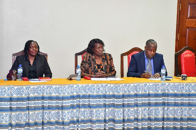 Dr. Doyne Kageni Mugambi Representing Executive Dean School of Education (left), Prof. Caroline Lang’at Thoruwa (DVC (RIO) (center) & Dr. Hamisi Babusa (Chairman Comtech Department) and Members of the School of Education and the University (right)