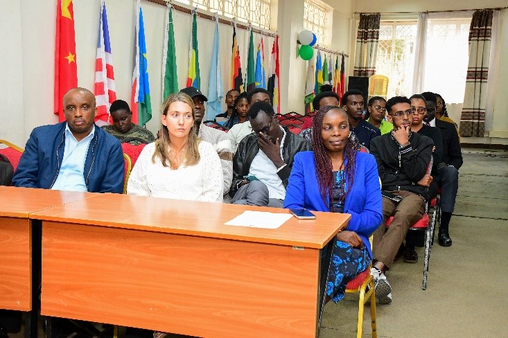 Dr. Gierszewska sitting with the staff and students attending the orientation meeting for international students